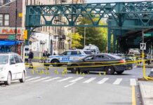 Coked-Up Crash Exposes Court Failure Police cars block a city intersection with yellow crime scene tape