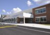 Diploma Mill Allegations Rock Nashville Modern school building with large windows and a clear sky