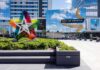 FBI Sting Stops Mall Bloodbath Mall entrance with colorful star sculpture and mirrored facade