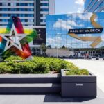 FBI Sting Stops Mall Bloodbath Mall entrance with colorful star sculpture and mirrored facade