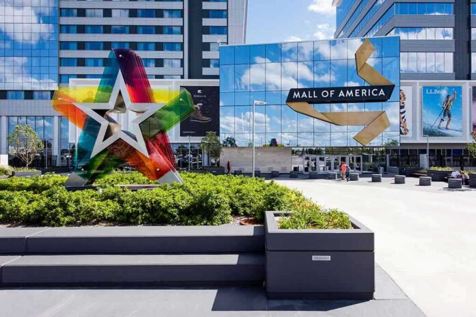 shutterstock_455150776 Mall entrance with colorful star sculpture and mirrored facade