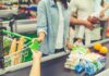 Senator Warns: Hunger Spike Hides In Plain Sight Customer paying with a card at a supermarket checkout