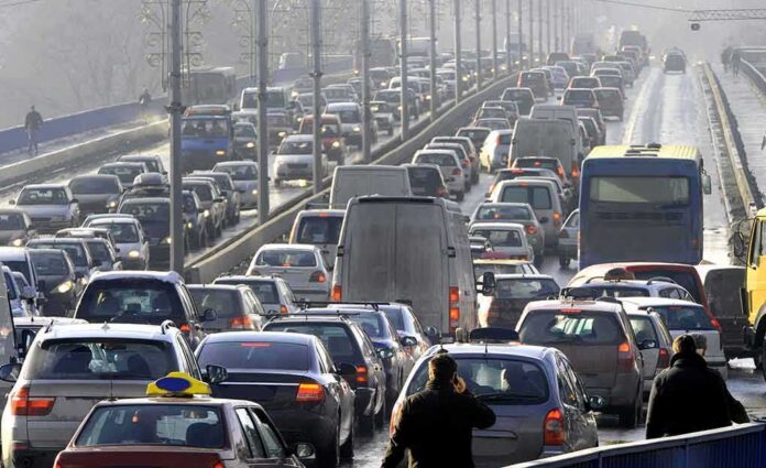 shutterstock_554001493 Heavy traffic jam on multi-lane city bridge