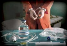 Execution Chaos Shocks Tennessee Medical vials and IV lines on a table with a handcuffed person in the background