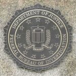 Shock Exit Rattles FBI Leadership FBI seal on a granite wall